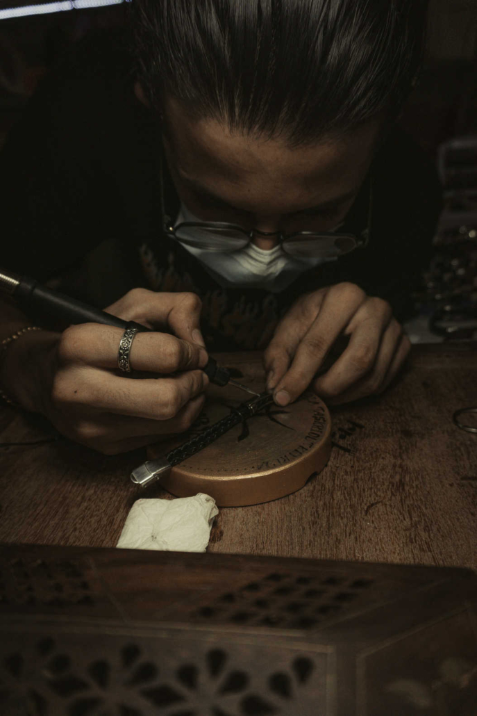 Expert jeweler performing intricate jewelry repair work in Philadelphia.