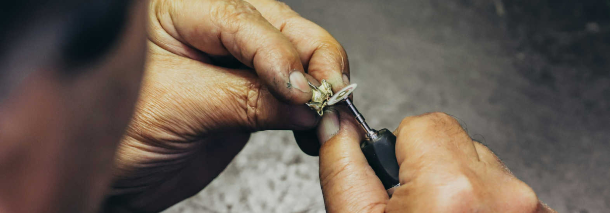 Jeweler carefully restoring a ring using precision tools at a workshop in Philadelphia