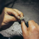 Jeweler carefully restoring a ring using precision tools at a workshop in Philadelphia