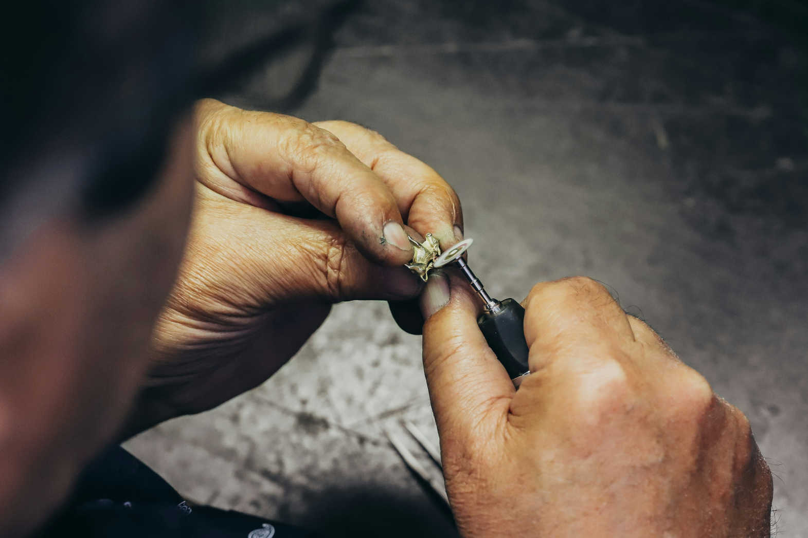 Jeweler carefully restoring a ring using precision tools at a workshop in Philadelphia